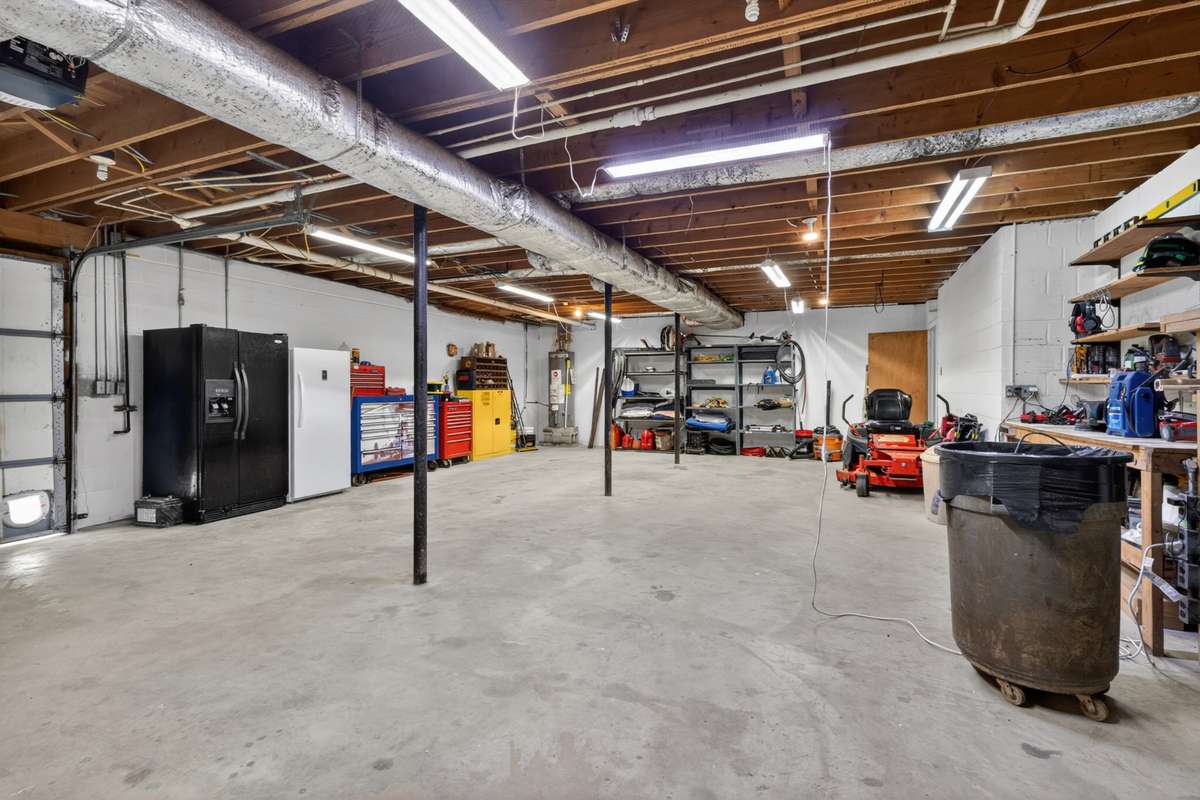 The basement runs the length of the entire house and has lots of workspace.