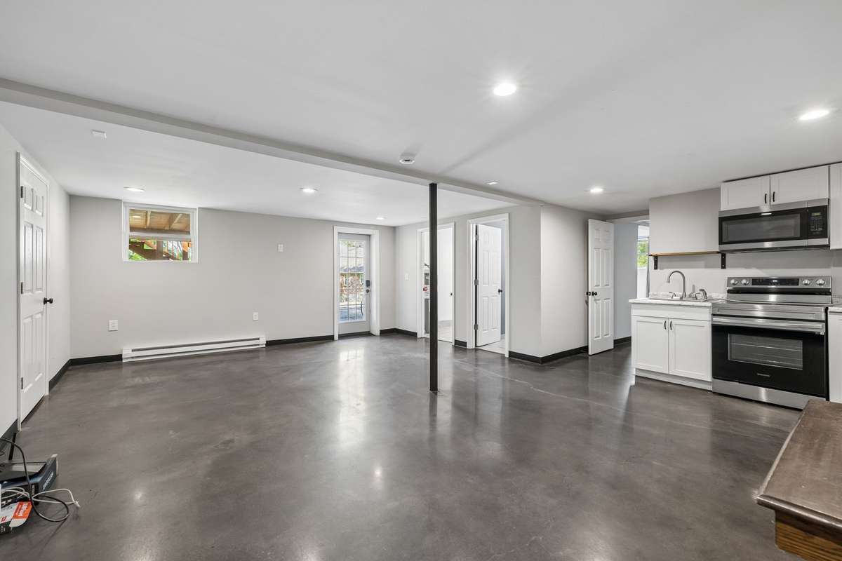 Fully finished basement featuring its own separate entrance, making it ideal as an income-producing rental unit or private mother-in-law suite. Full kitchen, bathroom, laundry area, and spacious living quarters.