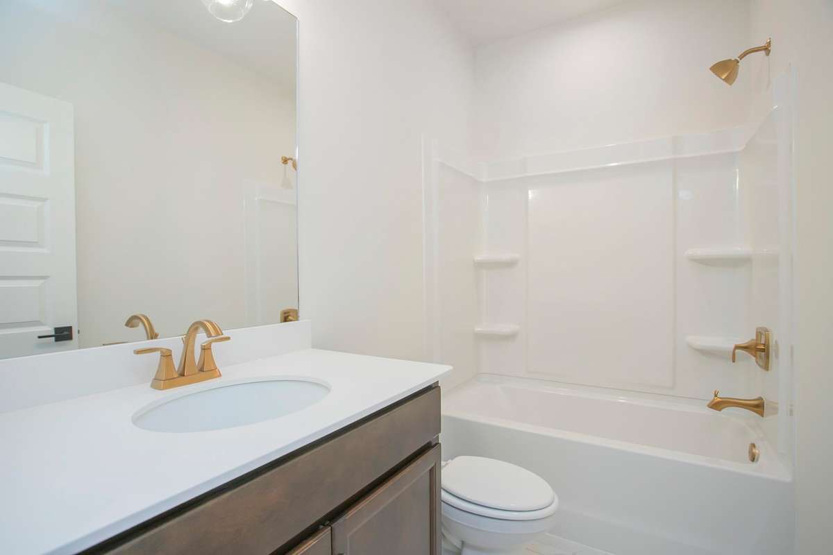 Full bathroom downstairs. All photos are of model home*