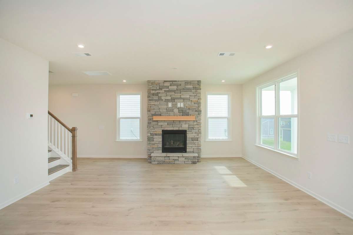 Overlooking the Great Room from the Kitchen. No Fireplace included. All photos are of model home*