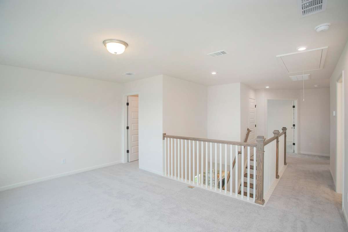 Large loft with extra storage closet. All photos are of model home*