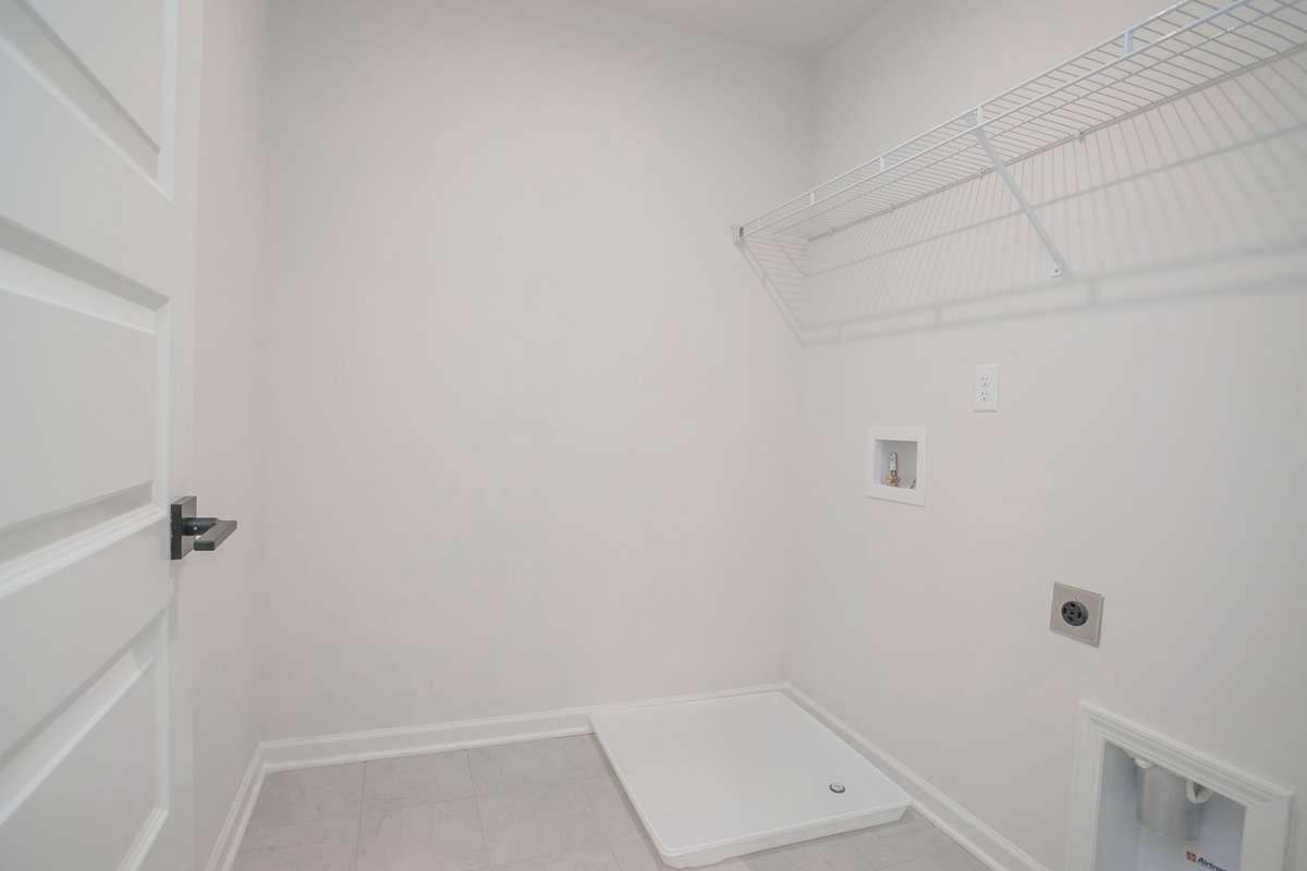 Laundry room upstairs. All photos are of model home*