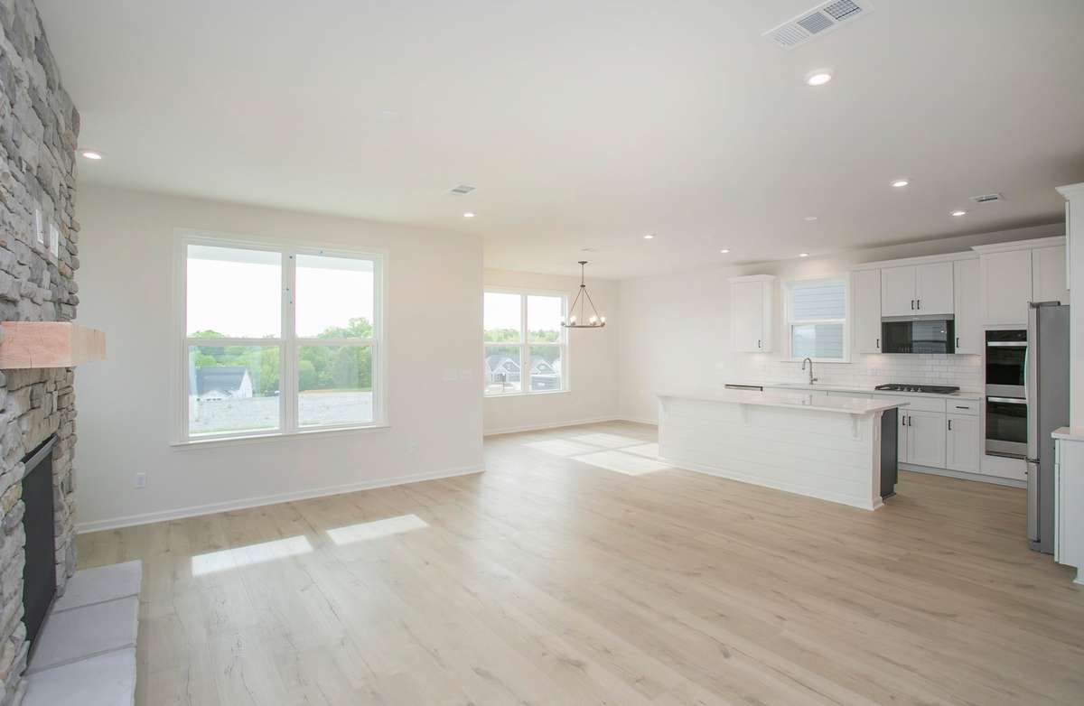 Open concept with dedicated Dining space. All photos are of model home*
