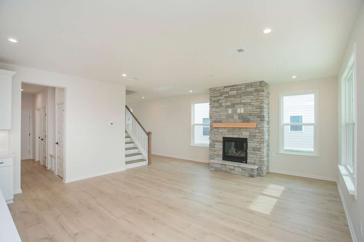 Nice, open Great Room to the Kitchen. No Fireplace included. All photos are of model home*