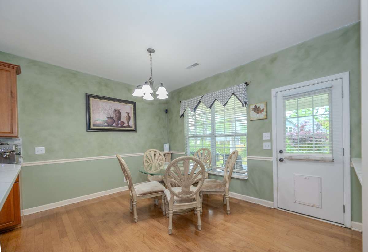 Breakfast Room has a great view of the covered back porch and back yard.