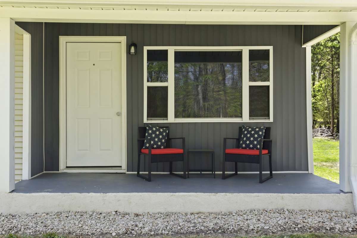 Large covered front porch invites you to relax