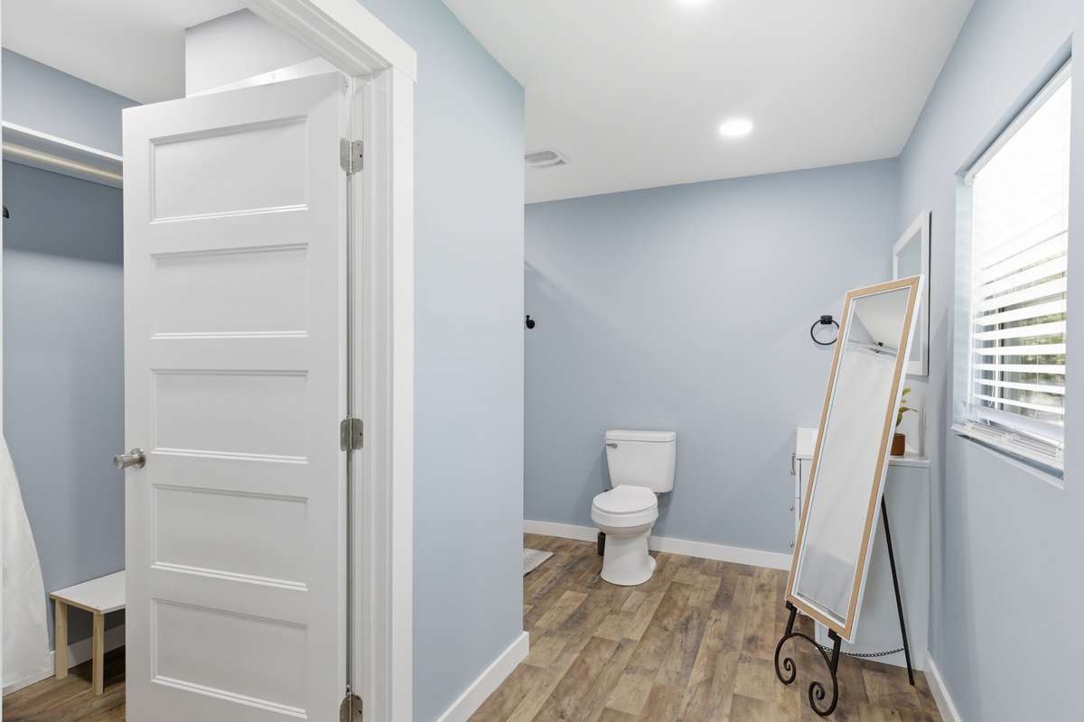 En suite bath is generously sized