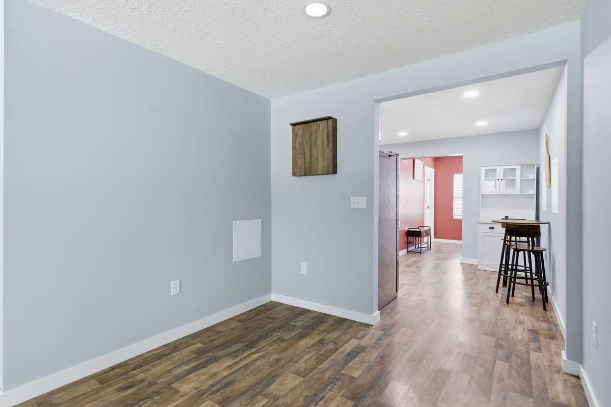 Nook adjacent to kitchen and den could be dining space or additional lounge area