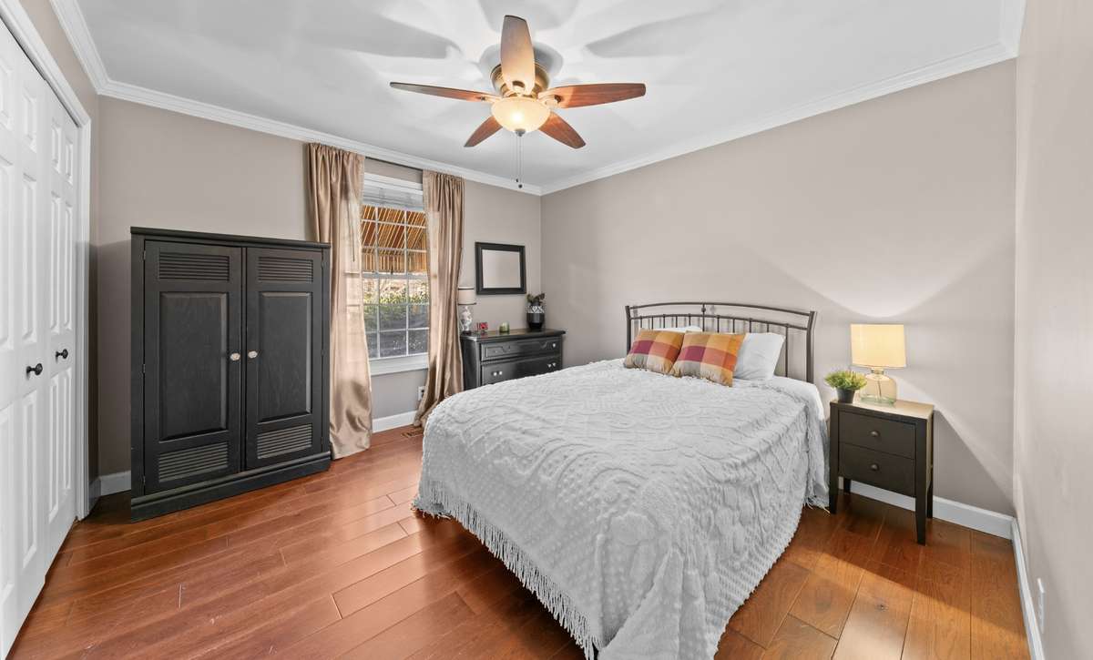 Bedroom 2 with wood flooring and extra closet space. (15x11)