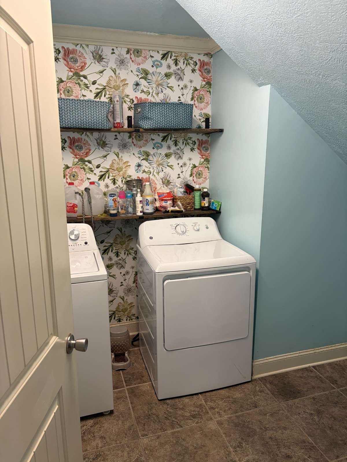 Laundry room downstairs off of the kitchen