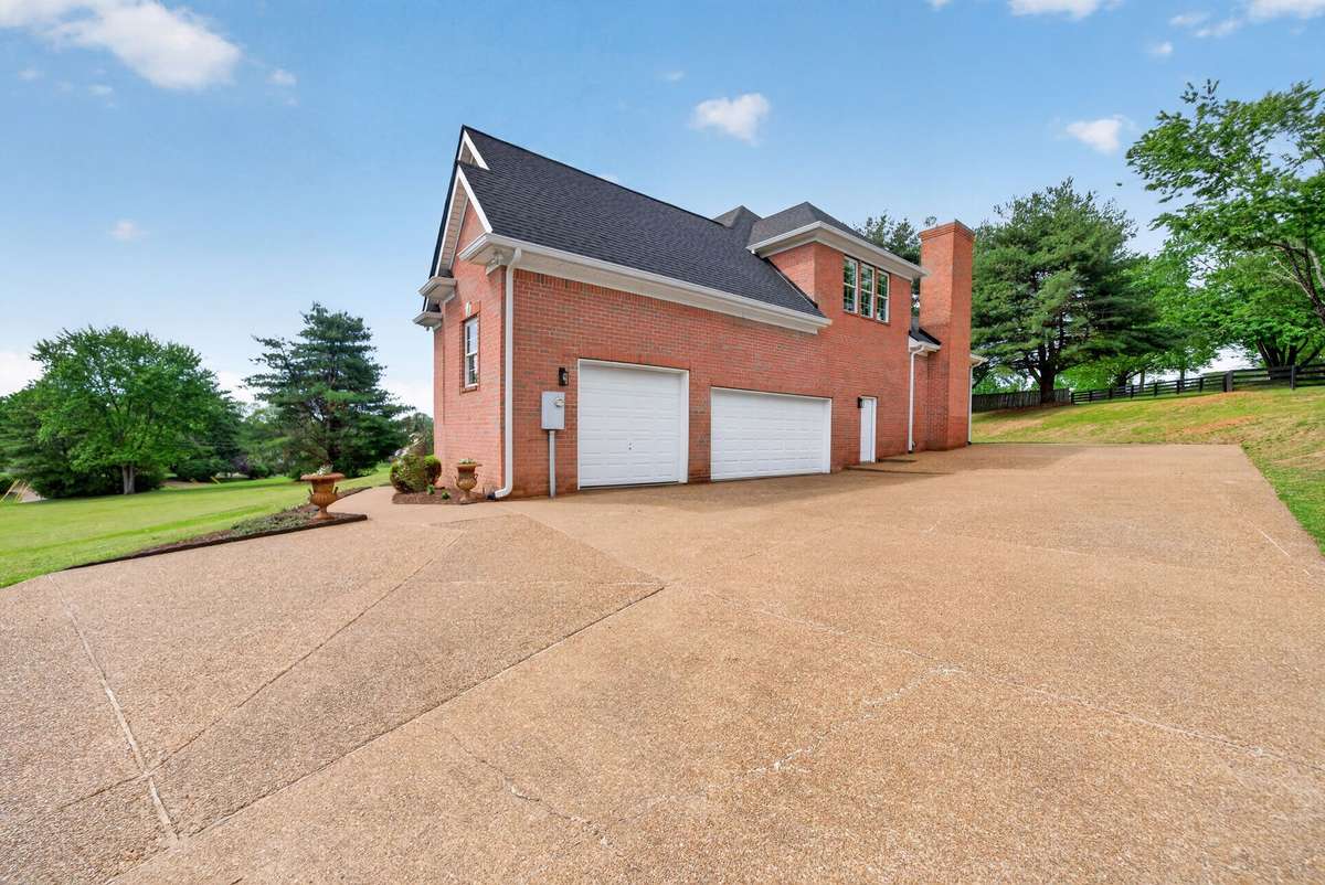 3 car garage with additional entry door directly into garage