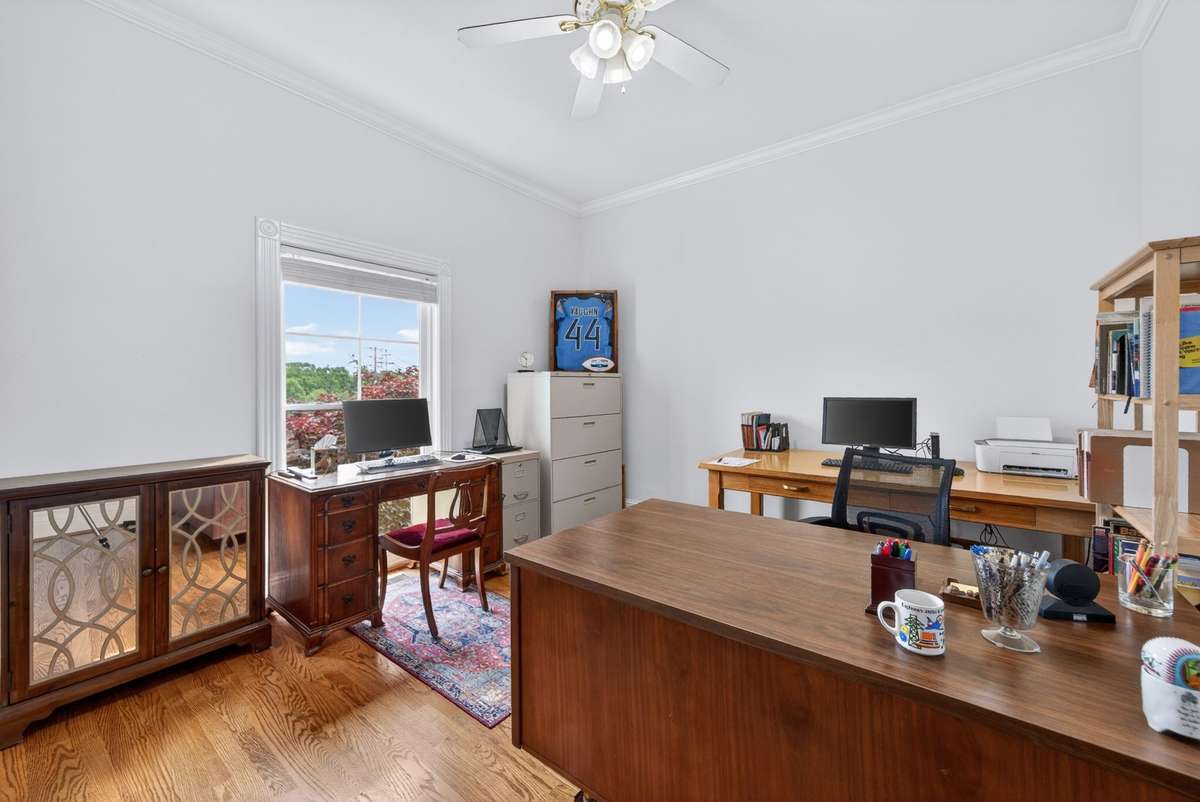 Downstairs bedroom/office. Hardwood flooring added in 2025.