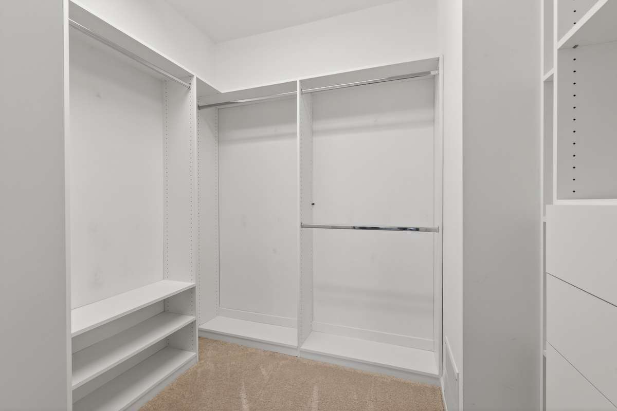 Closets by Design custom closet system in owners closet