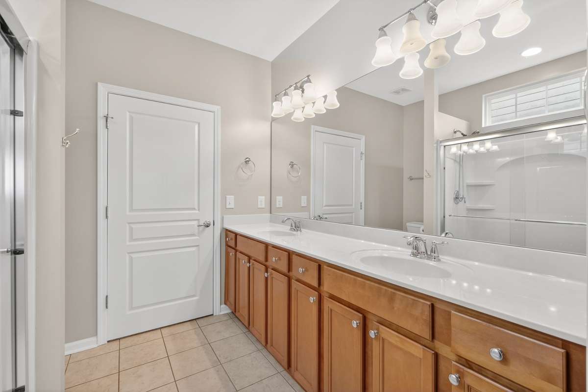 Raised double vanities in owners bathroom