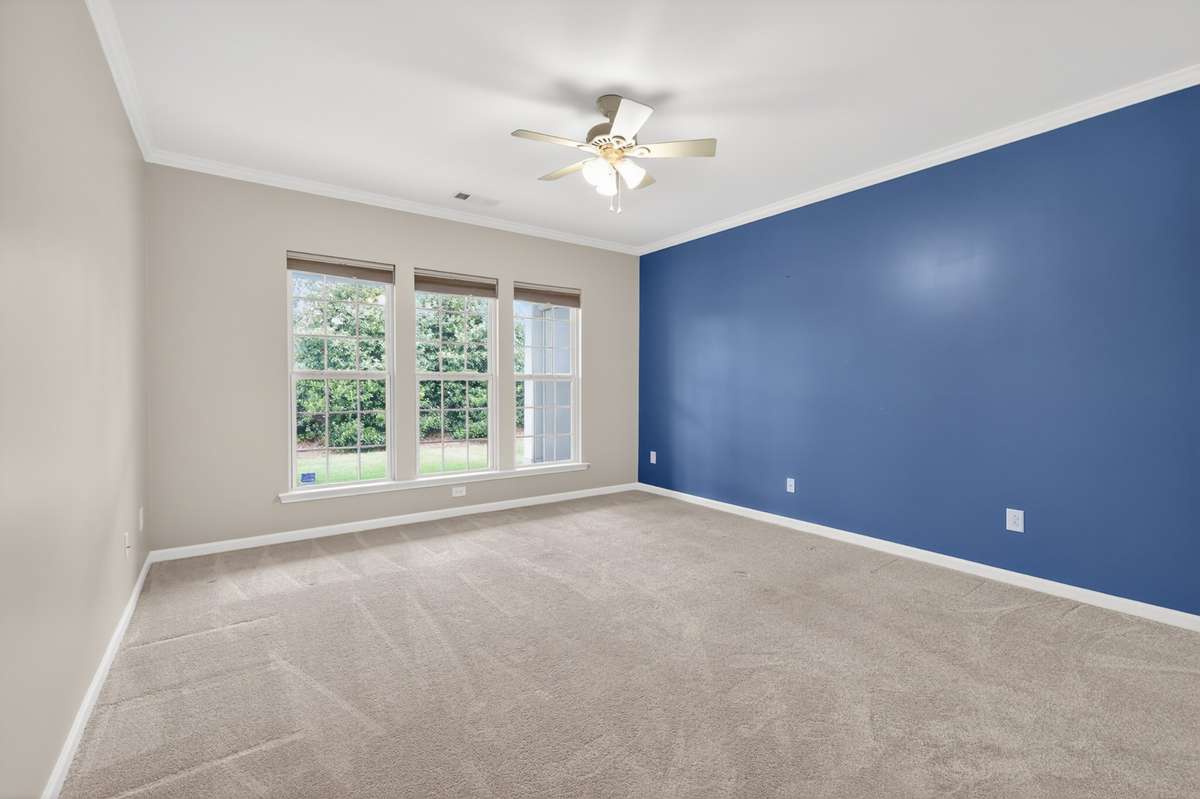Owners bedroom is large enough for a king sized bed and extra furniture