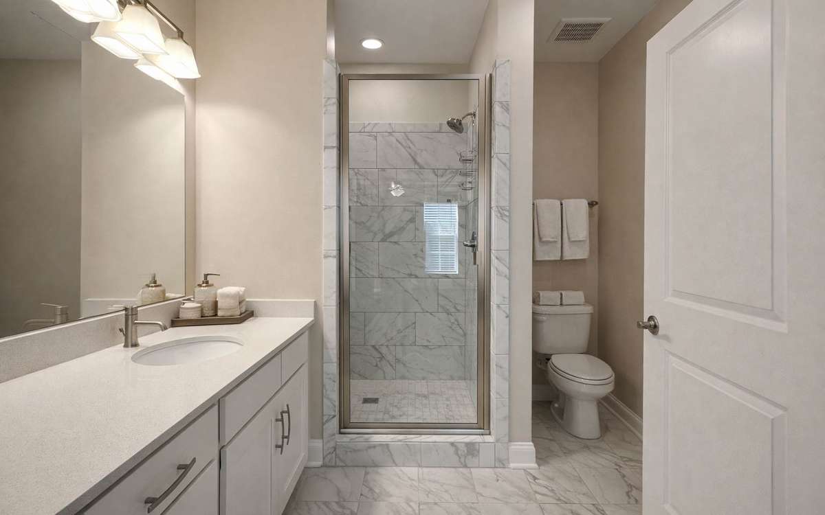 9'x9 Primary bedroom with en-suite bath with standing tile shower.