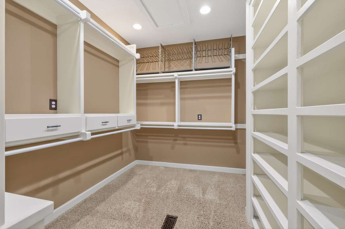 Custom shelving in the owners closet