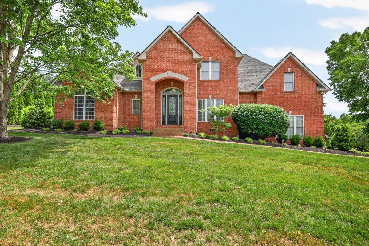 This full brick home rests on >.80 acres