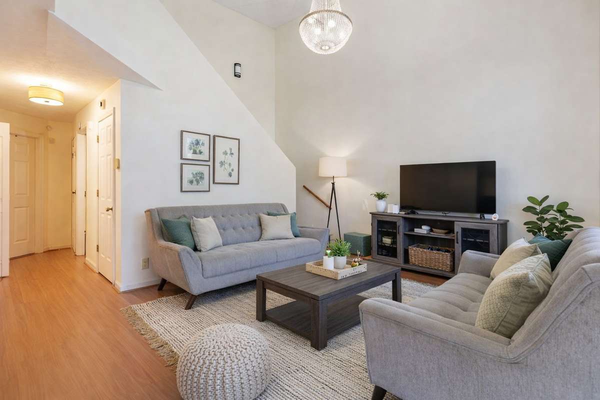 Vauled ceilings, new light fixtures, and new carpets. (Virtually staged.)