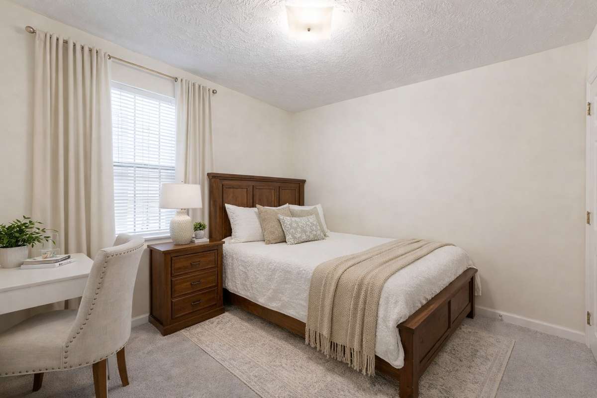 Secondary Bedrooms and full hallway bathroom on the main level. (Virtually staged)