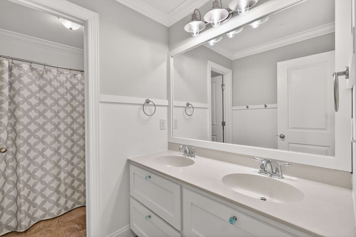 Hallway Bathroom with double vanities