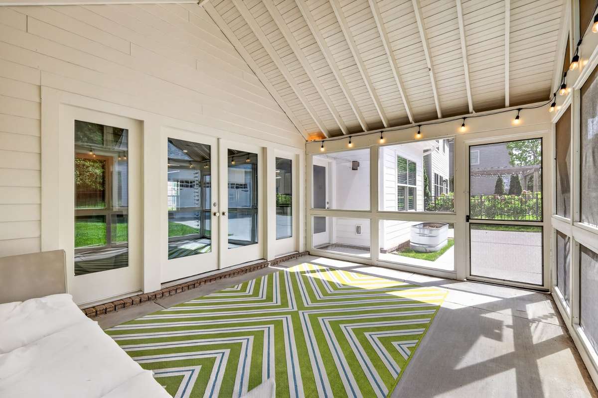Screened in porch makes for additional entertaining space or comfort to enjoy a quiet evening.
