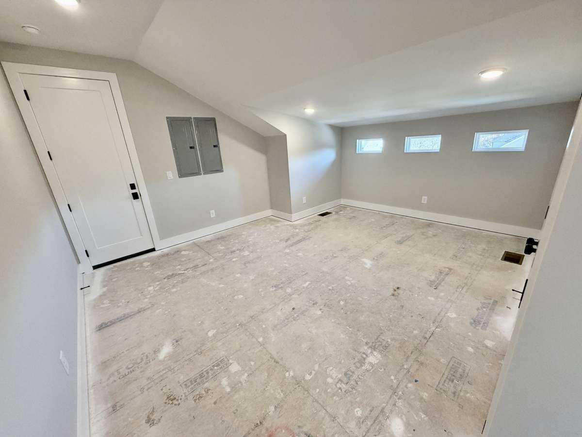 An incredible walk-in storage area with direct access to a one-car garage adds both convenience and future potential. Actual Home Photo — Fantastic Storage or Expansion Area Upstairs!