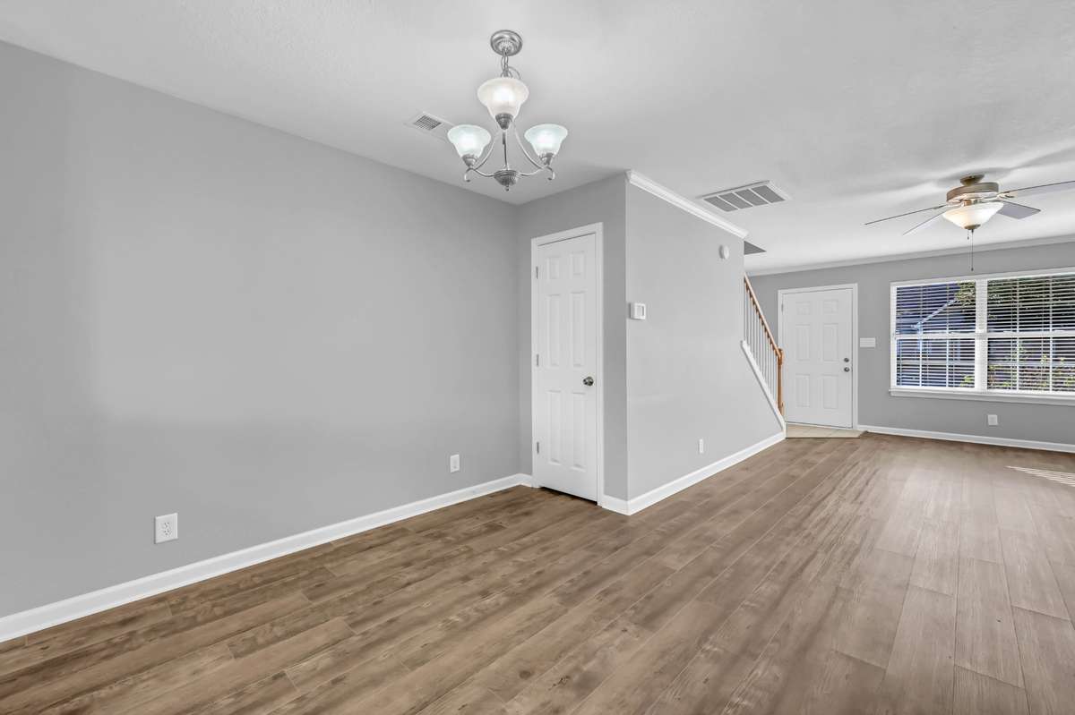 There is a coat closet under the stairs.