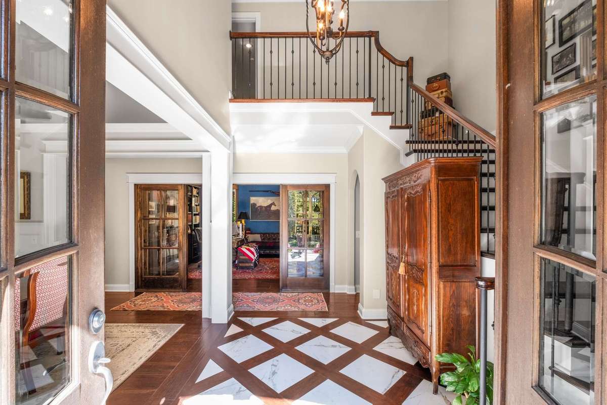 Two story entry foyer with marble inlay