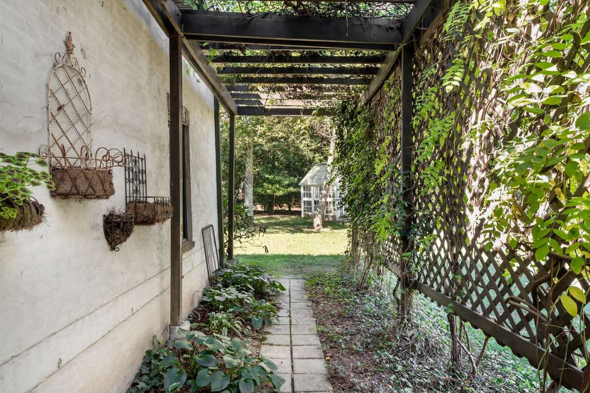 Garden path with trellis, so adorable and leads to the greenhouse