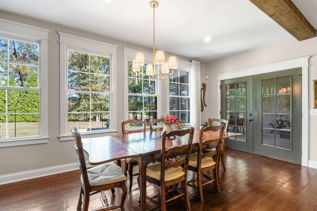 The kitchen dining leads out to the screened-in porch