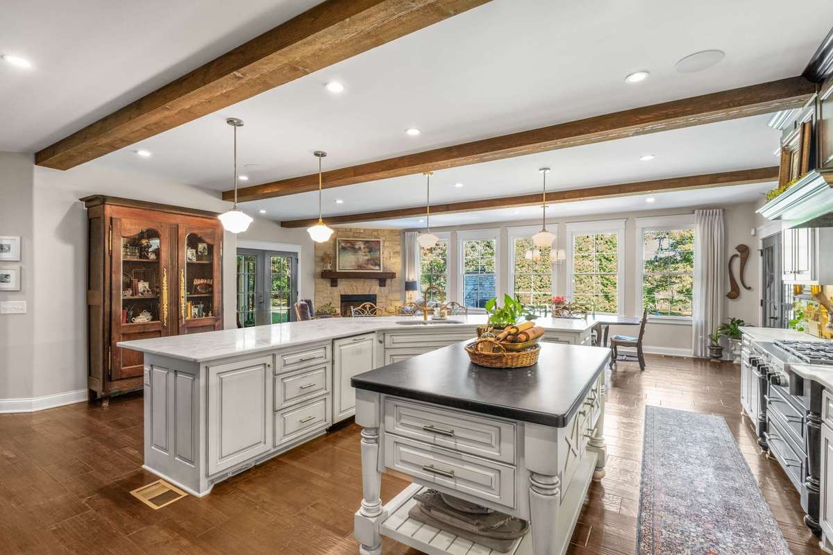 Drenched with light and augmented by the fireplace-equipped keeping room and eat in kitchen