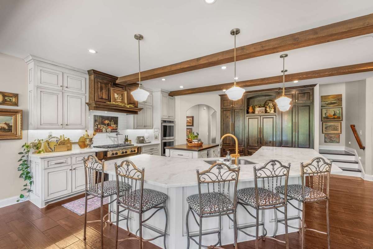 The kitchen with keeping room. Oversized island with seating on three sides.