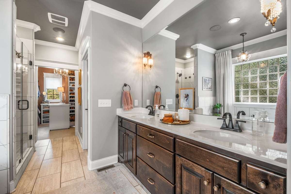Primary suite bath with dual vanities