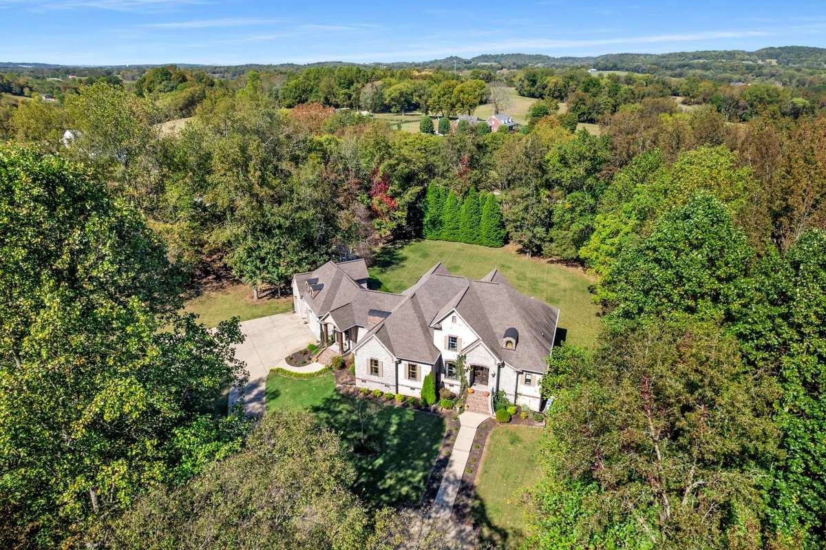 This is a perfect setting with privacy, excellent yard, pasture and wooded terrain