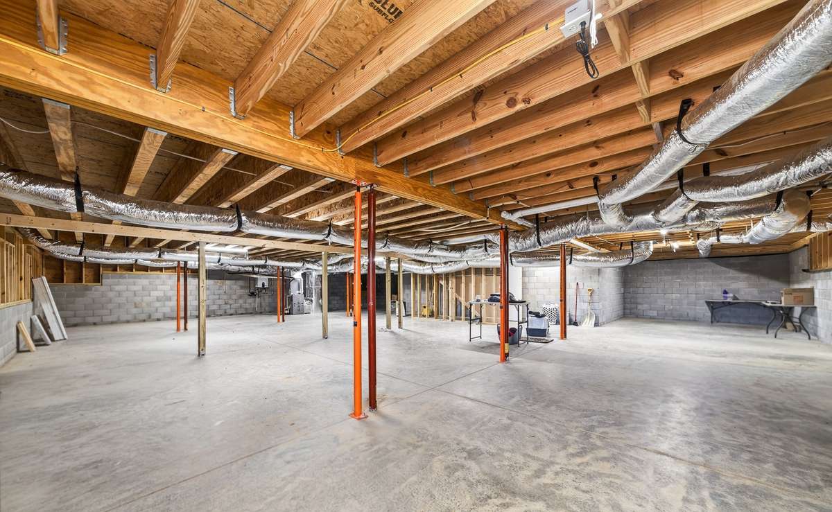 This image contains virtual staging to exhibit the potential of this full-size basement.