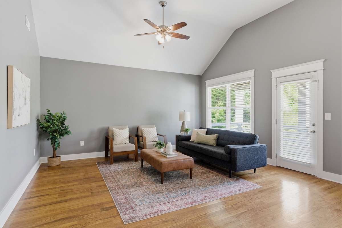 Upstairs flex room with tall ceiling and tons of natural light.