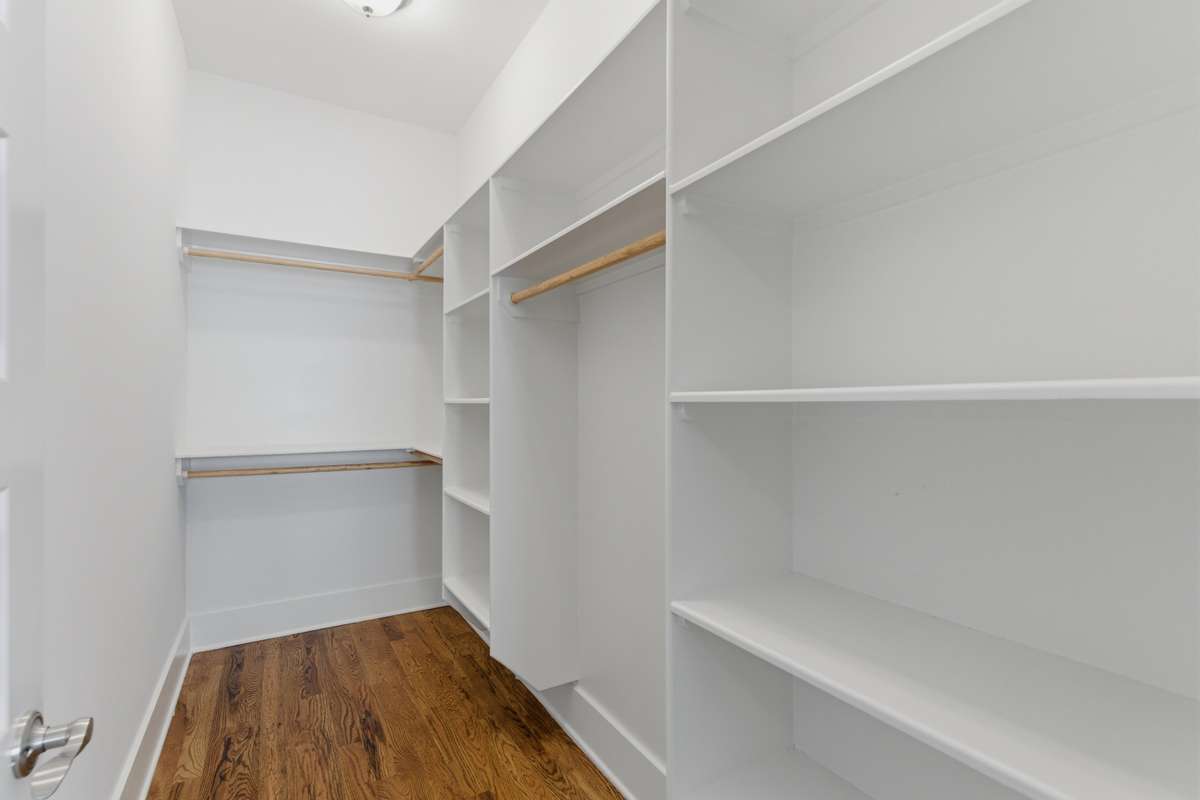 Primary walk-in closet.