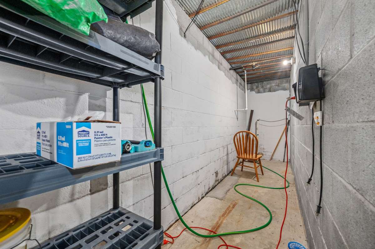 Storage/storm shelter under front porch