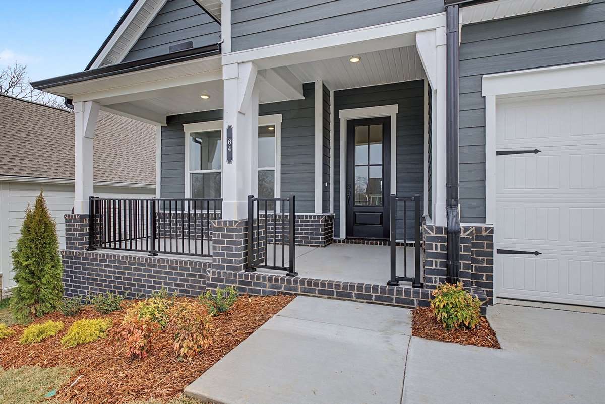 Front porch with plenty of room for seating and your spring ferns and flower pots.