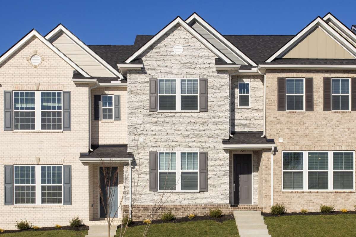 This Home Is The Center Home - Stone with Brick Skirt.