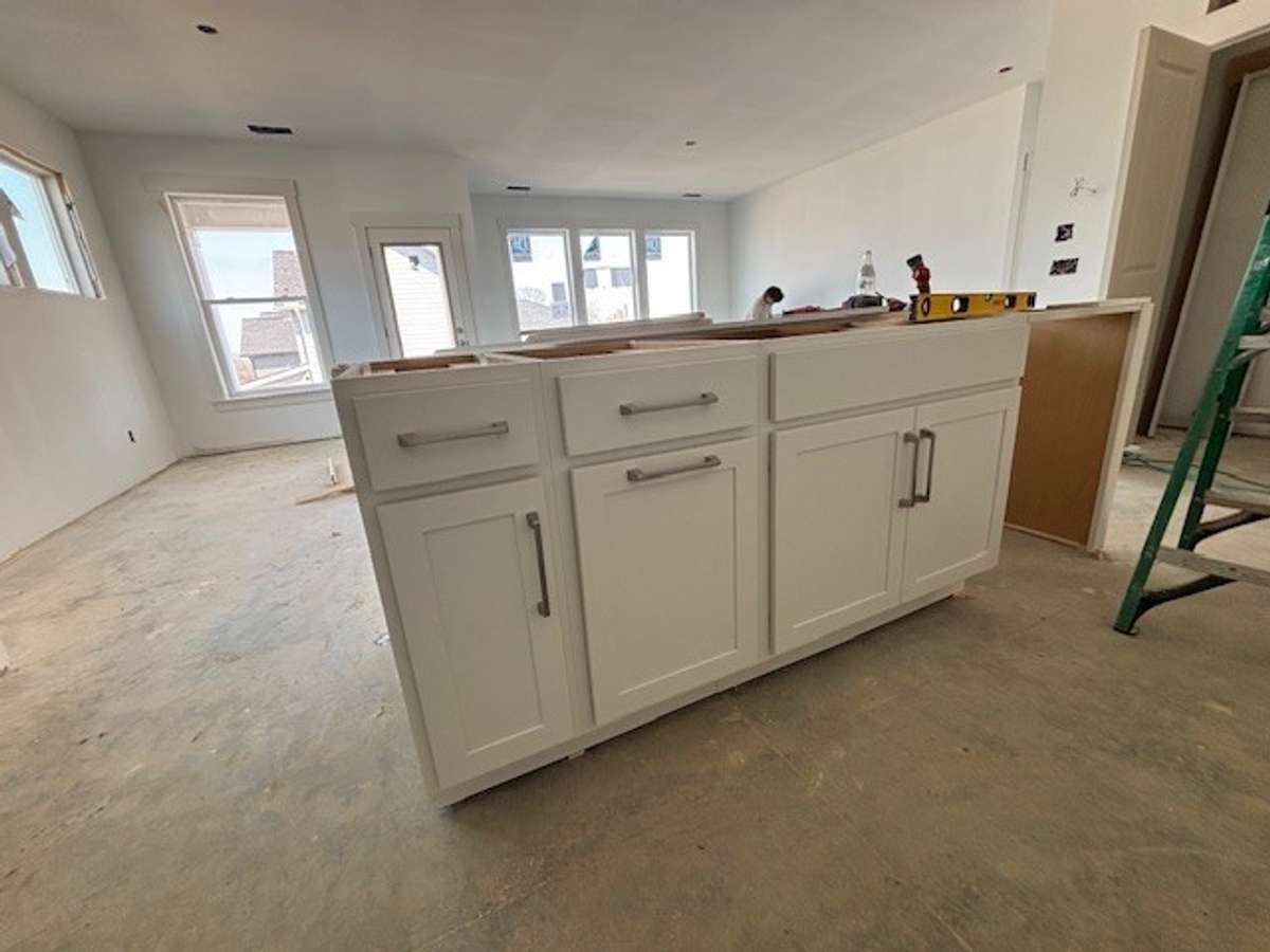 Large island with sink and dishwasher.
