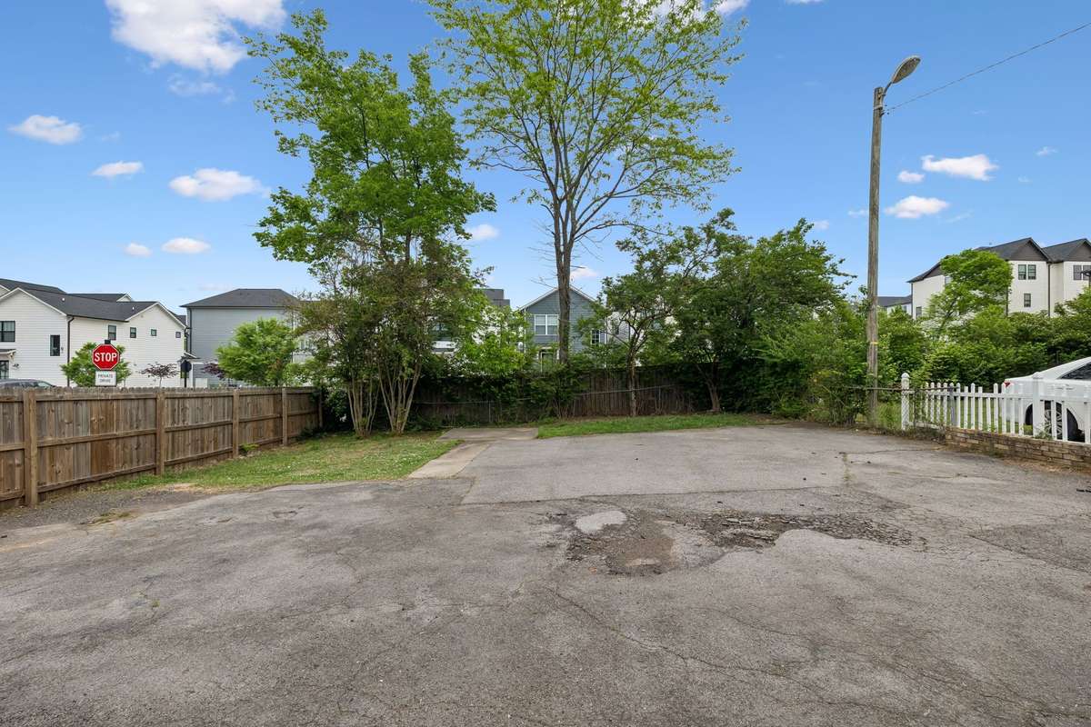 Partially fenced in backyard.