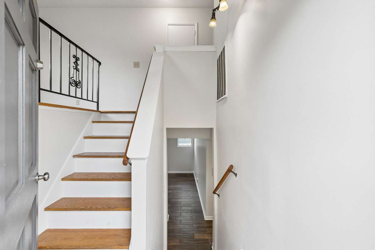 Upon walking you see the pretty hardwood floors and fresh paint.