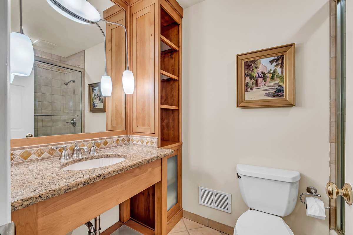 Full hall bath w/tiled shower-tub + custom vanity
