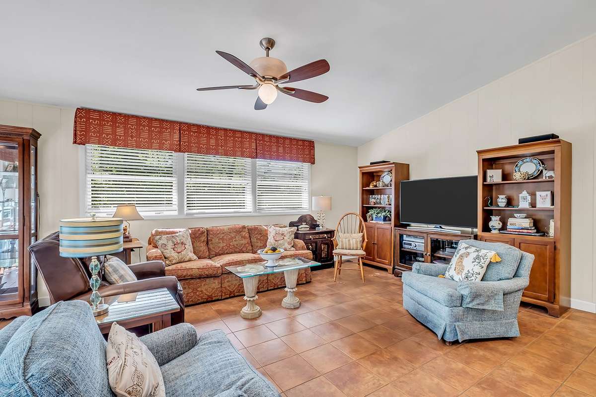 Tons of natural light, wood paneling, stone tile floors keep you cool in summer