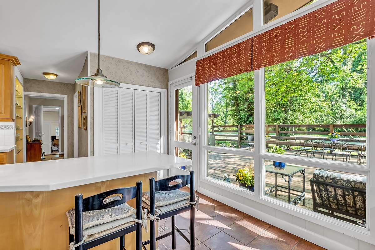Breakfast bar, pantry, and built-in lighted book/China shelf