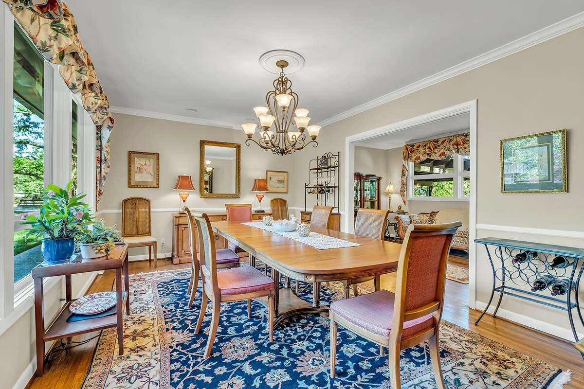 Lots of natural light, chair rail detail, recessed lighting + chandelier