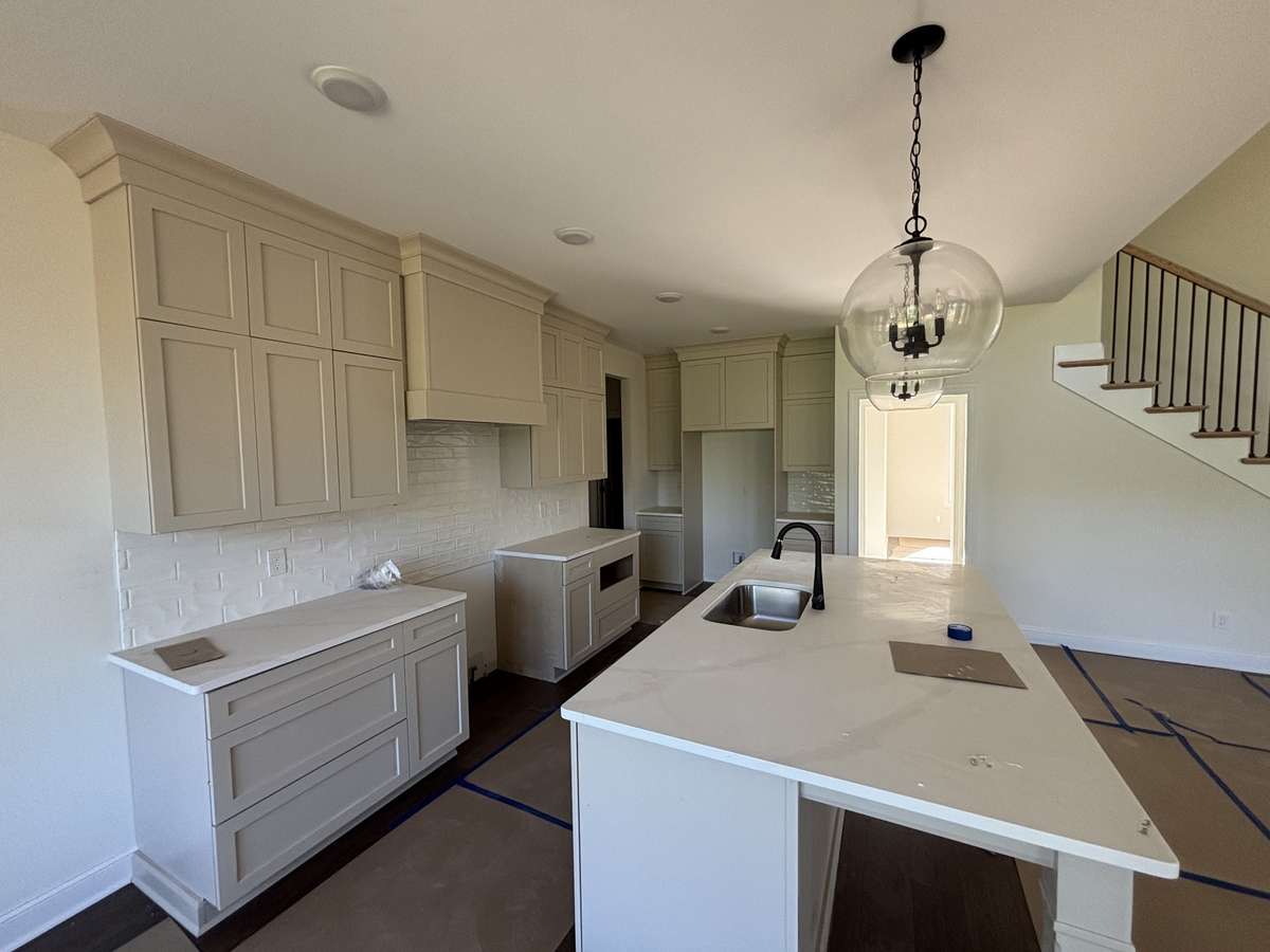 Gas cooktop is 36", custom cabinets to the ceiling