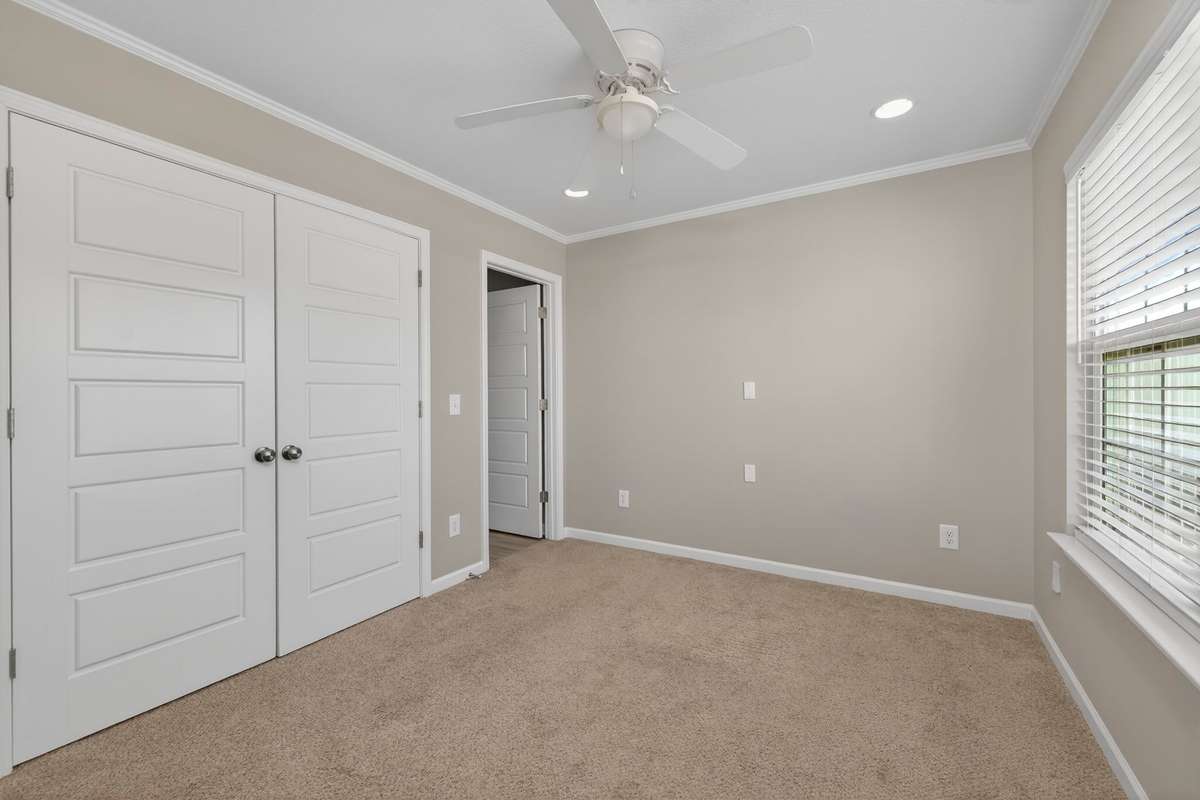 This level also features a guest bedroom complete with its own en suite full bath—perfect for visitors or a private home office.